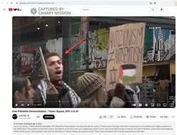 Cameron Jones appears at a protest featuring signs equating Zionism with antisemitism and endorsing anti-Israel violence.